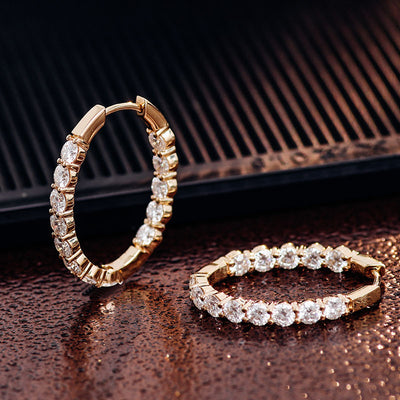 Stunning Yellow Gold Huggies Hoop Earrings featuring 28 round-cut 3mm Moissanite Diamonds with VVS clarity and DEF color, symbolizing unmatched luxury and brilliance.