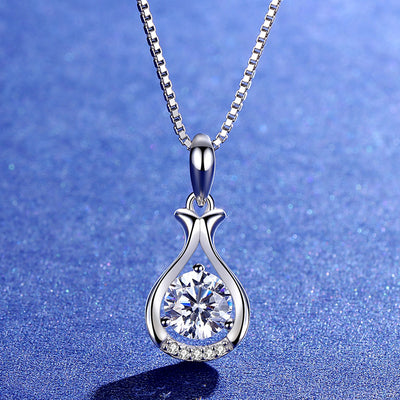 Beautiful one-of-a-kind 1 CT round moissanite lab-created diamond pendant necklace, plated with white gold on a 925 sterling silver drop shape chain