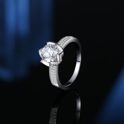 Stunning flower-shaped moissanite diamond ring with pave sparkles and white gold plating